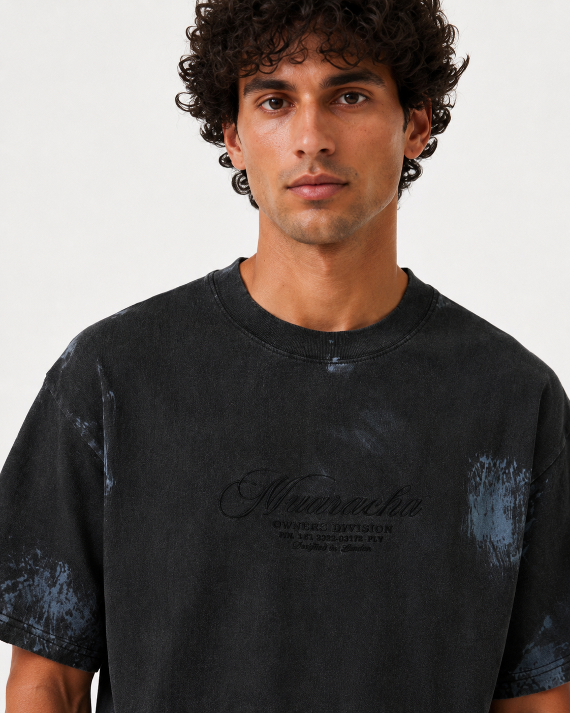 MUARACHA Script Tee Black Stone Washed — detail, washed black fabric texture